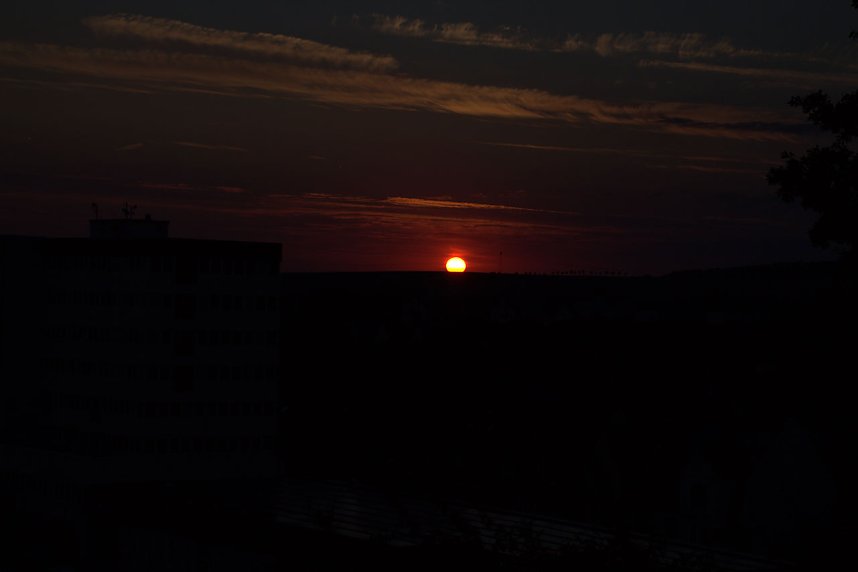 Stadt- und Sonnenansichten